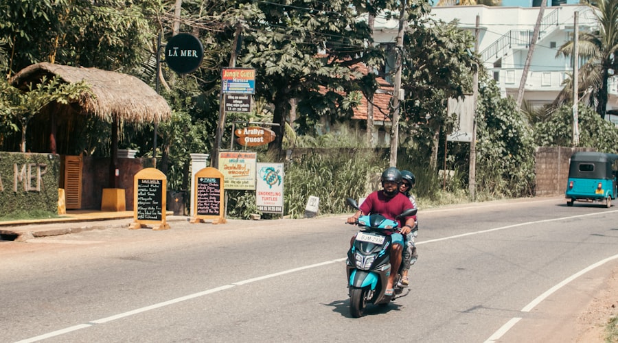 Scooter on a tropical road lined with palm trees